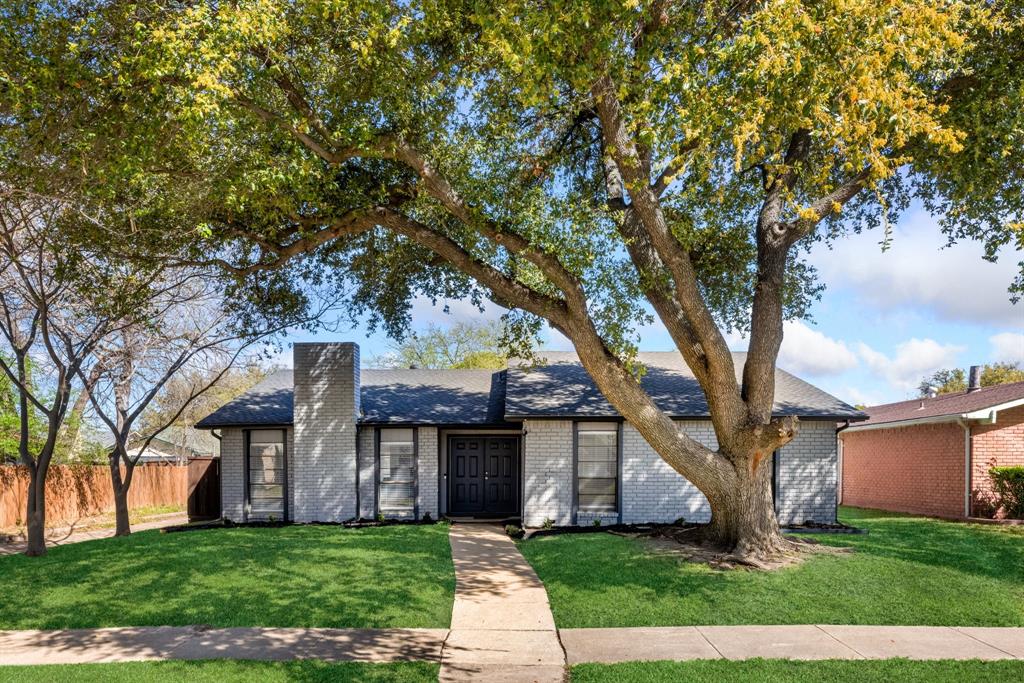 3429 Post Oak Road Garland, TX 75044 - Photo 2 of 36 a front view of a house with a yard