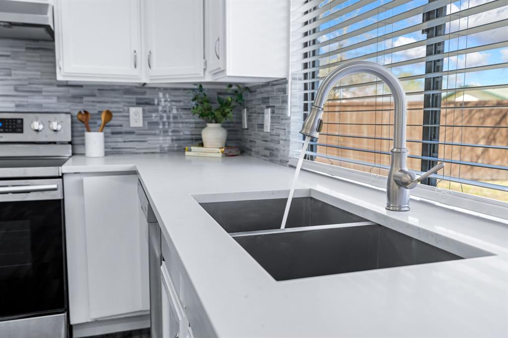 3429 Post Oak Road Garland, TX 75044 - Photo 21 of 36 a kitchen with a sink and a window