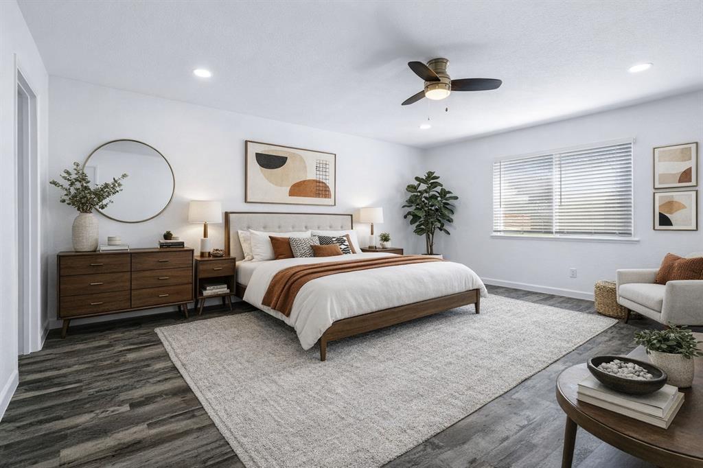 3429 Post Oak Road Garland, TX 75044 - Photo 24 of 36 a bedroom with a bed mirror and a window