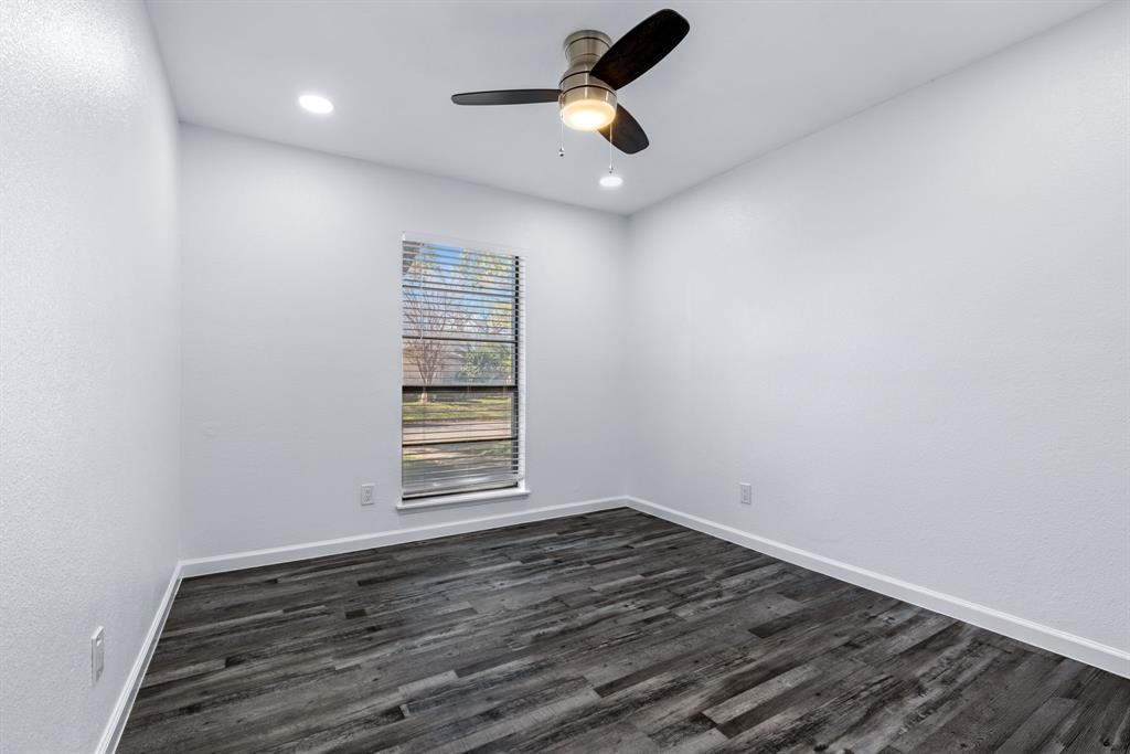 3429 Post Oak Road Garland, TX 75044 - Photo 28 of 36 a view of empty room with wooden floor and fan