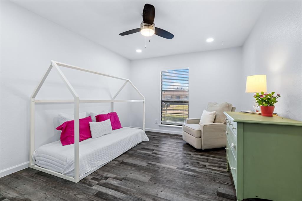 3429 Post Oak Road Garland, TX 75044 - Photo 29 of 36 a living room with furniture and painting on the wall