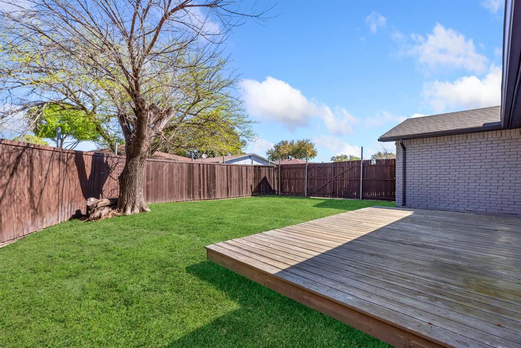 3429 Post Oak Road Garland, TX 75044 - Photo 33 of 36 a view of a backyard with wooden floor