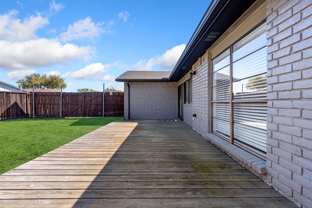 3429 Post Oak Road Garland, TX 75044 - Photo 34 of 36 a view of a backyard with wooden fence