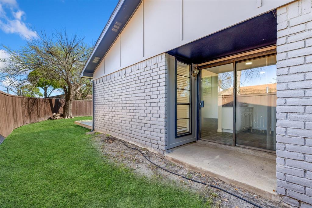 3429 Post Oak Road Garland, TX 75044 - Photo 35 of 36 a backyard of a house with lots of green space