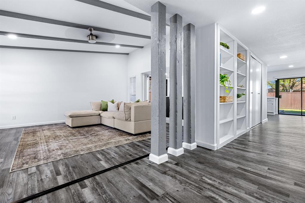 3429 Post Oak Road Garland, TX 75044 - Photo 4 of 36 a living room with furniture and a wooden floor