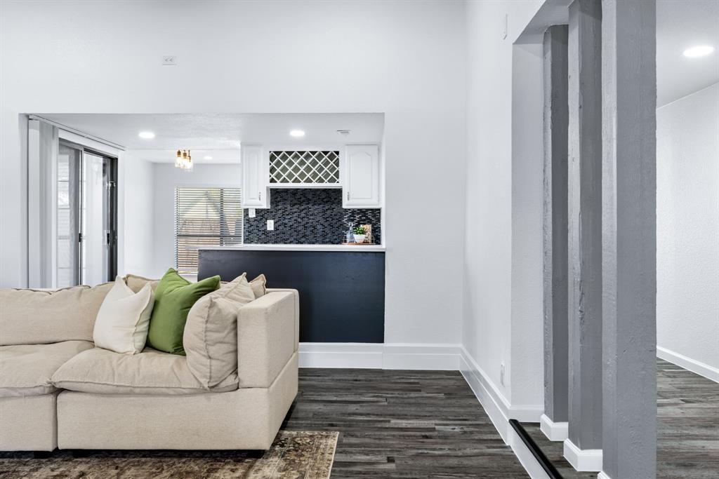 3429 Post Oak Road Garland, TX 75044 - Photo 9 of 36 a living room with furniture and a rug