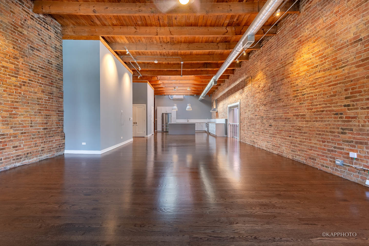 1141 West Madison Street, Unit 3 Chicago, IL 60607 - Photo 13 of 34 a view of a hallway with wooden floor