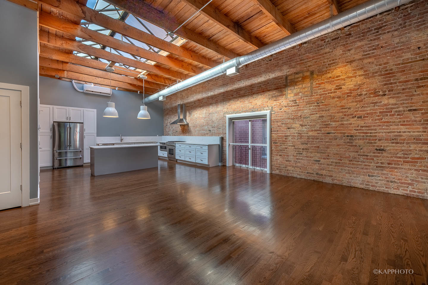 1141 West Madison Street, Unit 3 Chicago, IL 60607 - Photo 16 of 34 a view of a livingroom with wooden floor