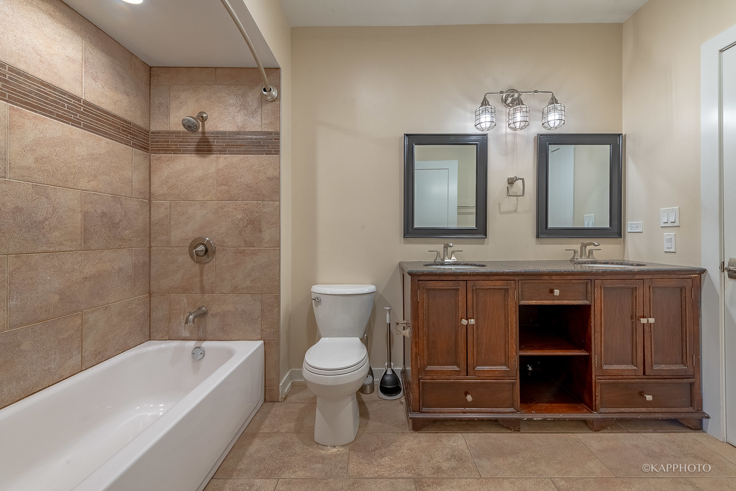 1141 West Madison Street, Unit 3 Chicago, IL 60607 - Photo 24 of 34 a bathroom with a bathtub shower sink and toilet