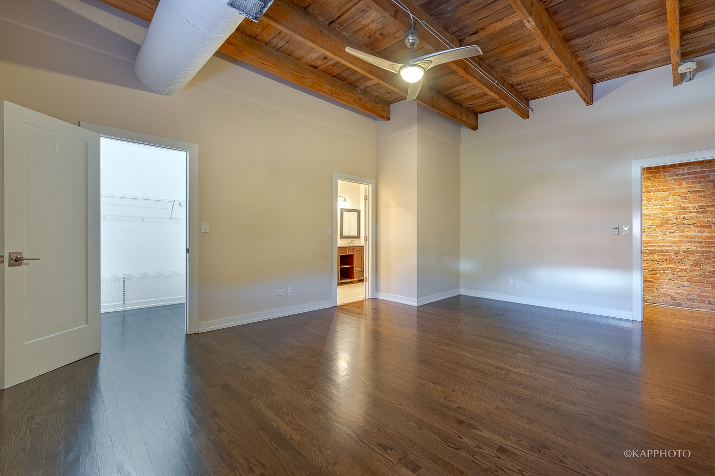1141 West Madison Street, Unit 3 Chicago, IL 60607 - Photo 27 of 34 a view of an empty room with wooden floor and a window