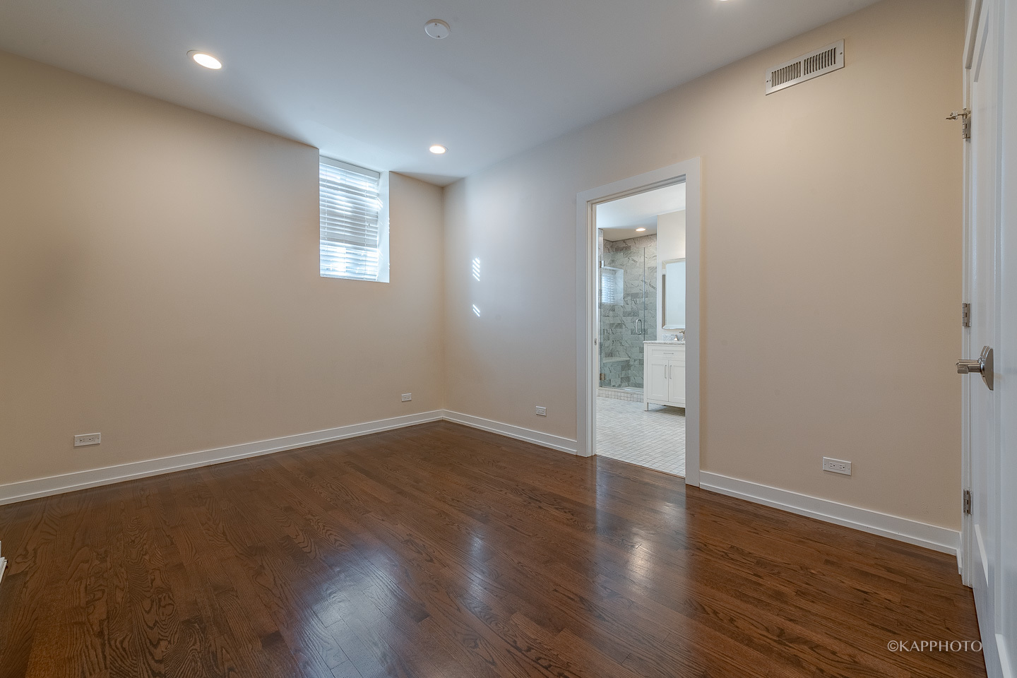 1141 West Madison Street, Unit 3 Chicago, IL 60607 - Photo 29 of 34 an empty room with wooden floor and windows