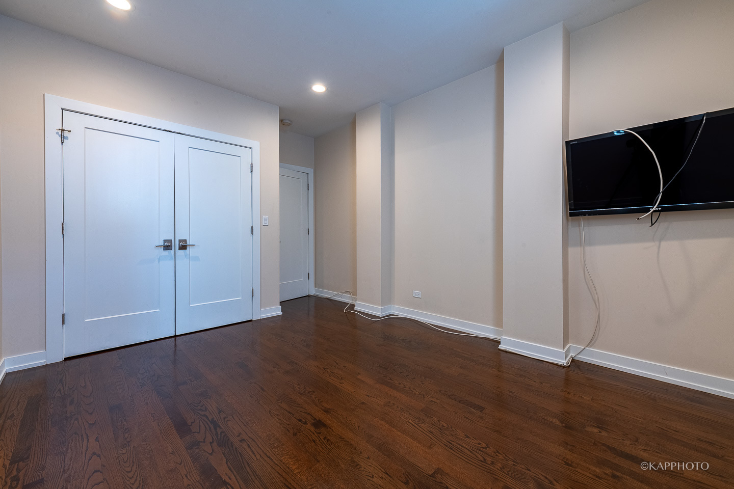 1141 West Madison Street, Unit 3 Chicago, IL 60607 - Photo 30 of 34 an empty room with wooden floor and cabinet