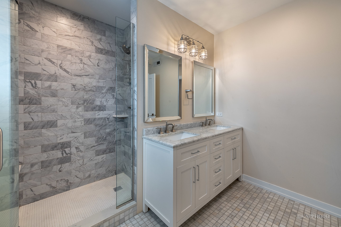 1141 West Madison Street, Unit 3 Chicago, IL 60607 - Photo 33 of 34 a bathroom with a granite countertop sink a mirror and a bathtub