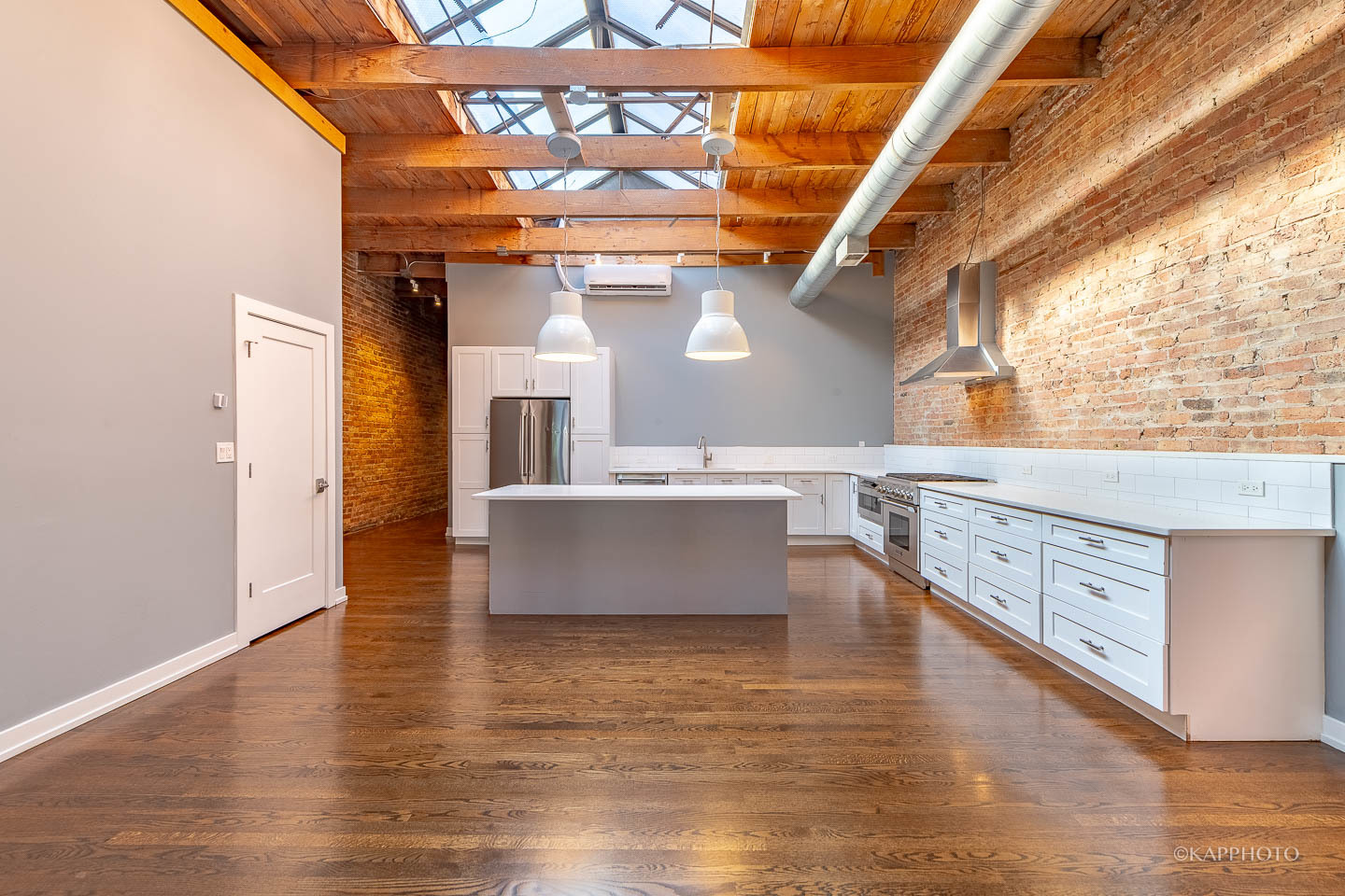 1141 West Madison Street, Unit 3 Chicago, IL 60607 - Photo 5 of 34 a view of kitchen with stainless steel appliances wooden floor