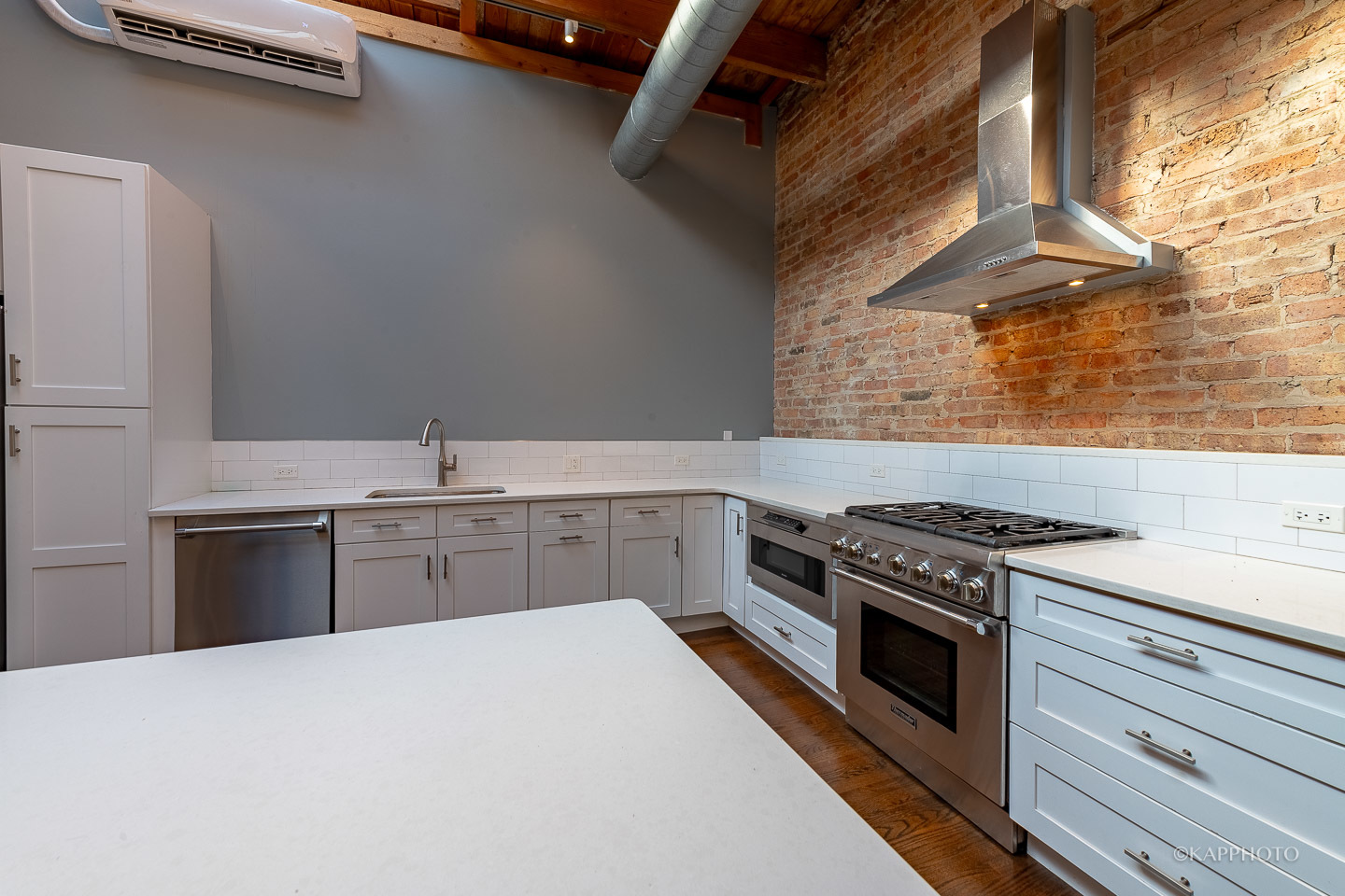 1141 West Madison Street, Unit 3 Chicago, IL 60607 - Photo 6 of 34 a kitchen with a stove and a sink