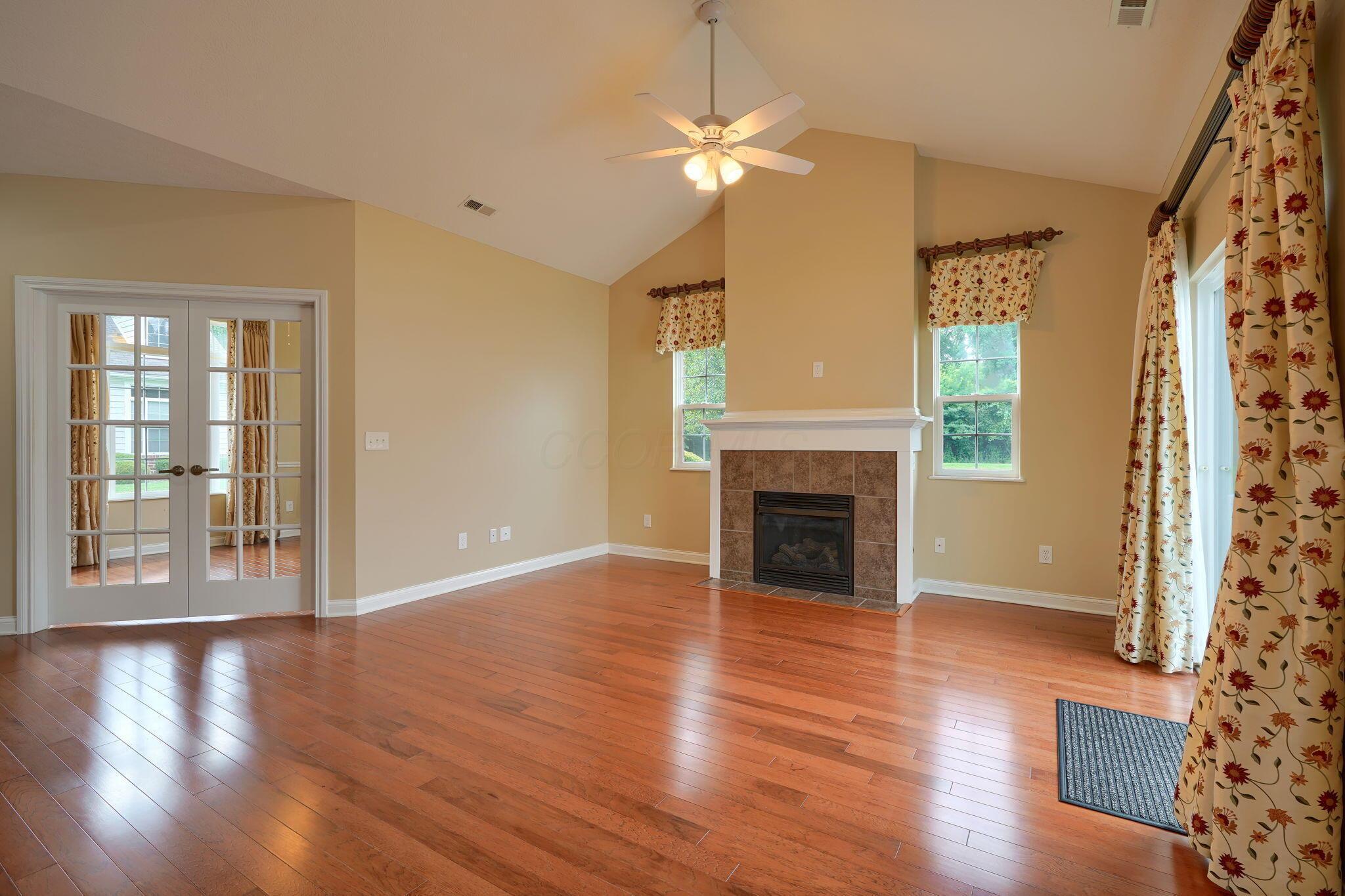 6911 Rothwell Street, Unit 5 New Albany, OH 43054 - Photo 8 of 44 Vaulted ceiling with lighted fan