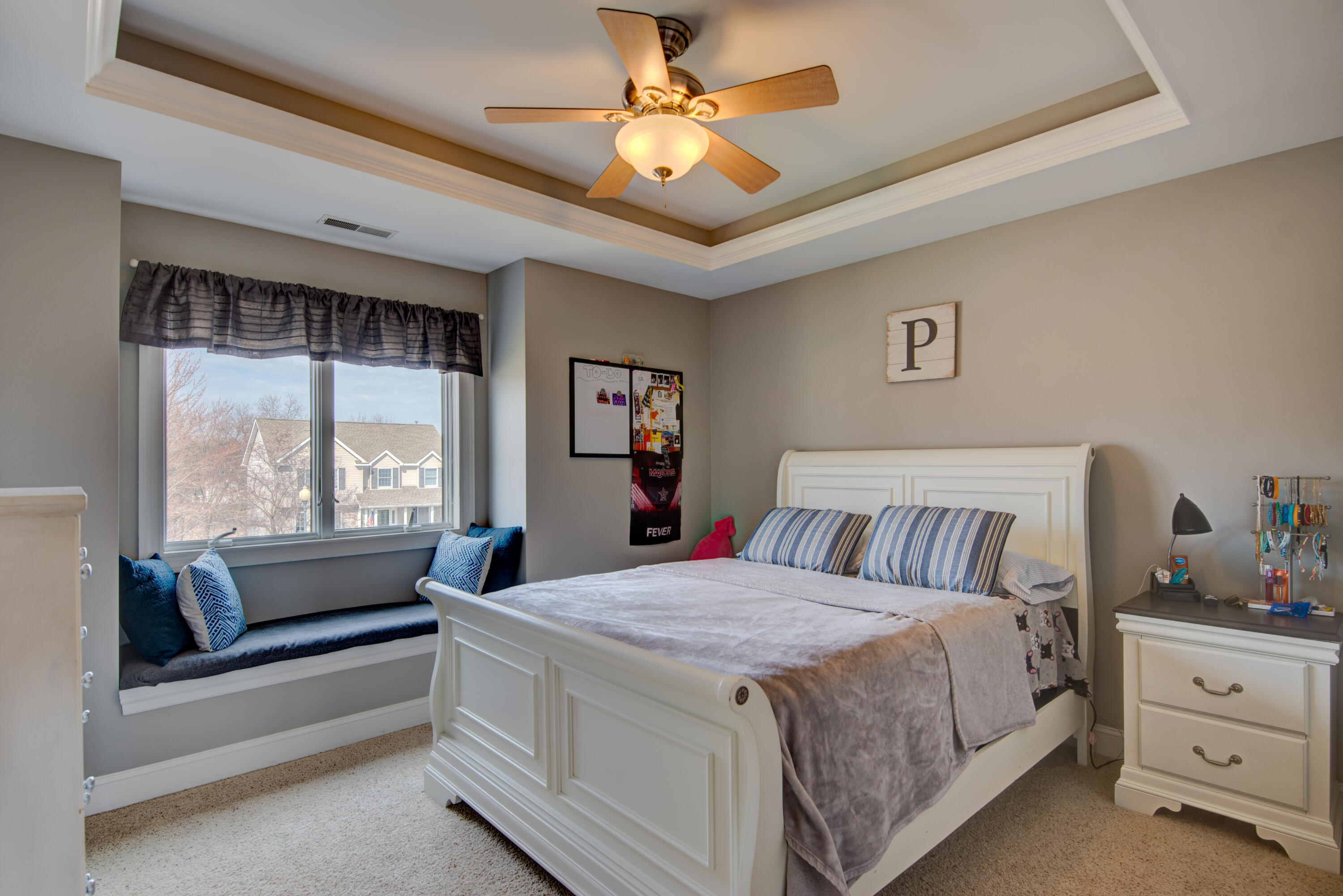 669 Davis Circle Crown Point, IN 46307 - Photo 14 of 22 a bedroom with a large bed and a chandelier fan