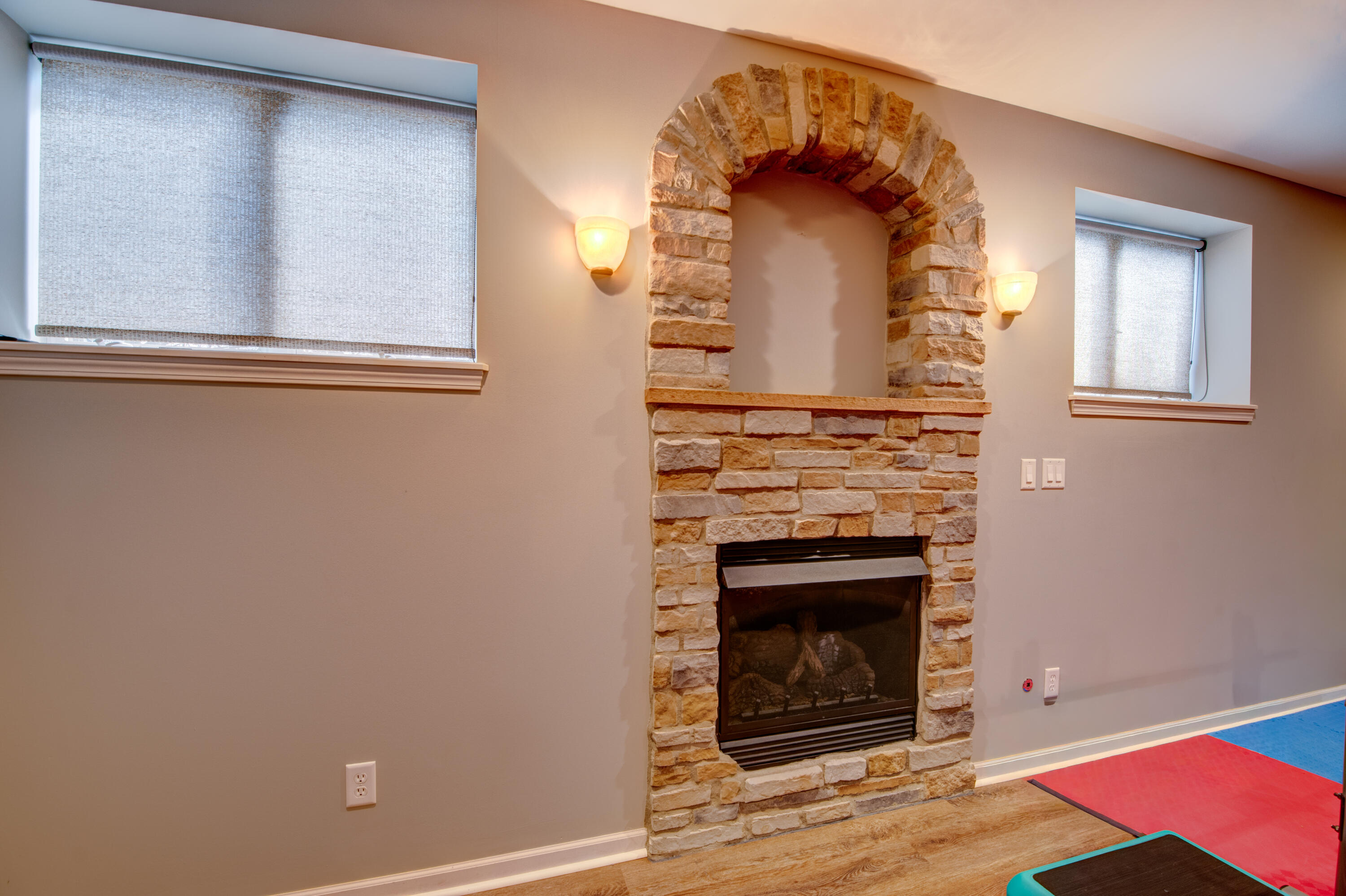 669 Davis Circle Crown Point, IN 46307 - Photo 19 of 22 a view of a livingroom with wooden floor and a fireplace