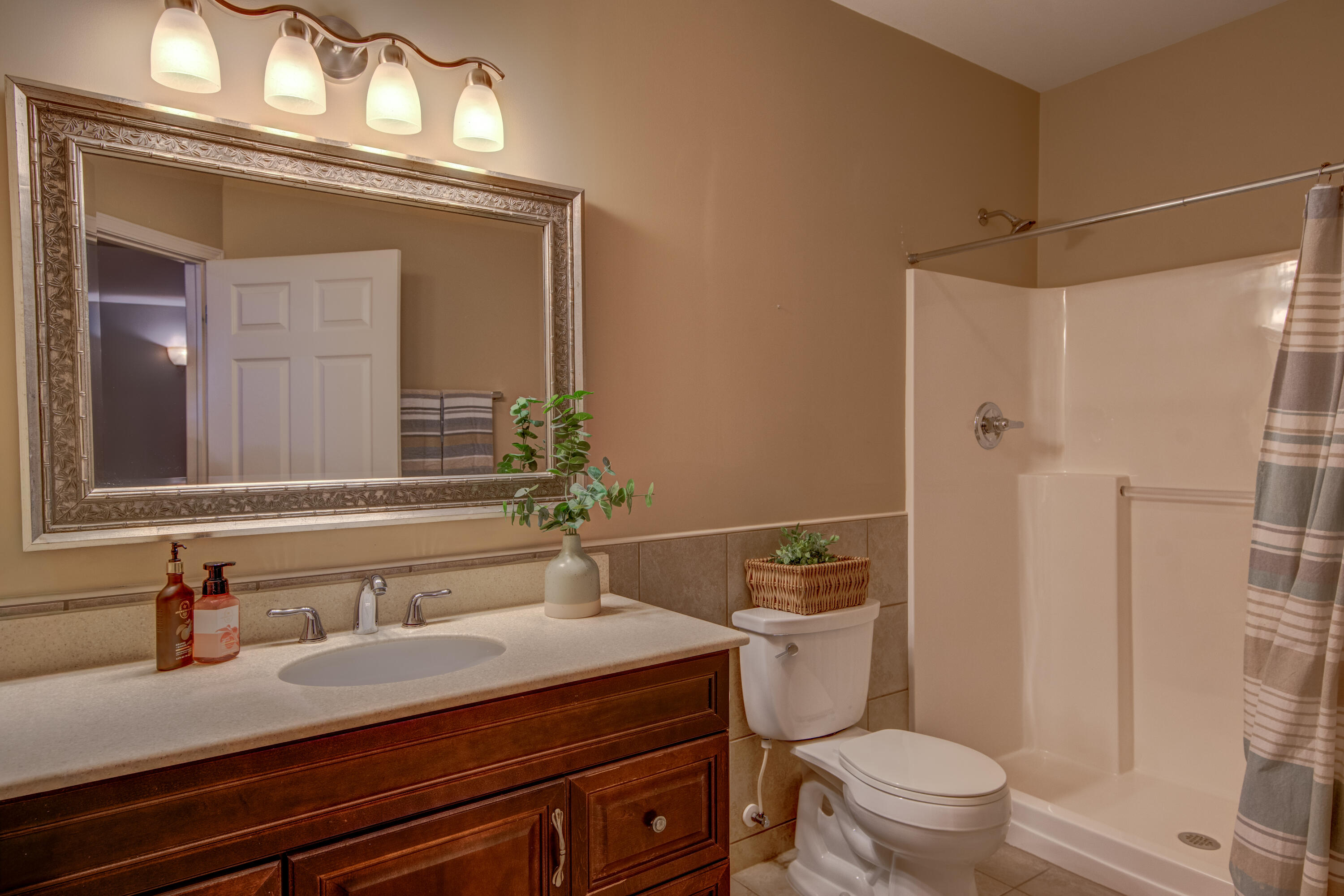 669 Davis Circle Crown Point, IN 46307 - Photo 20 of 22 a bathroom with a sink a toilet and shower