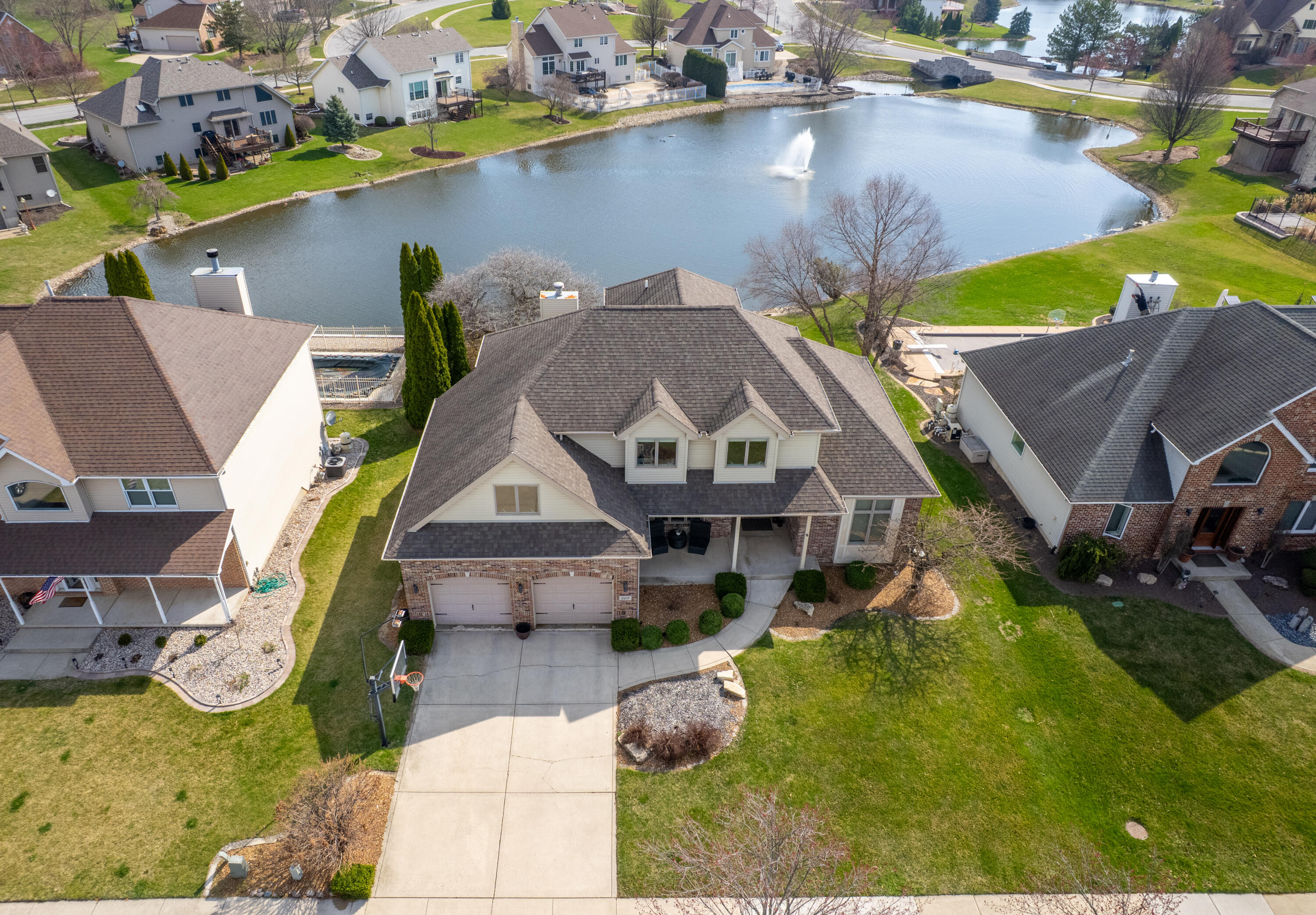 669 Davis Circle Crown Point, IN 46307 - Photo 2 of 22 an aerial view of a house with swimming pool and ocean view