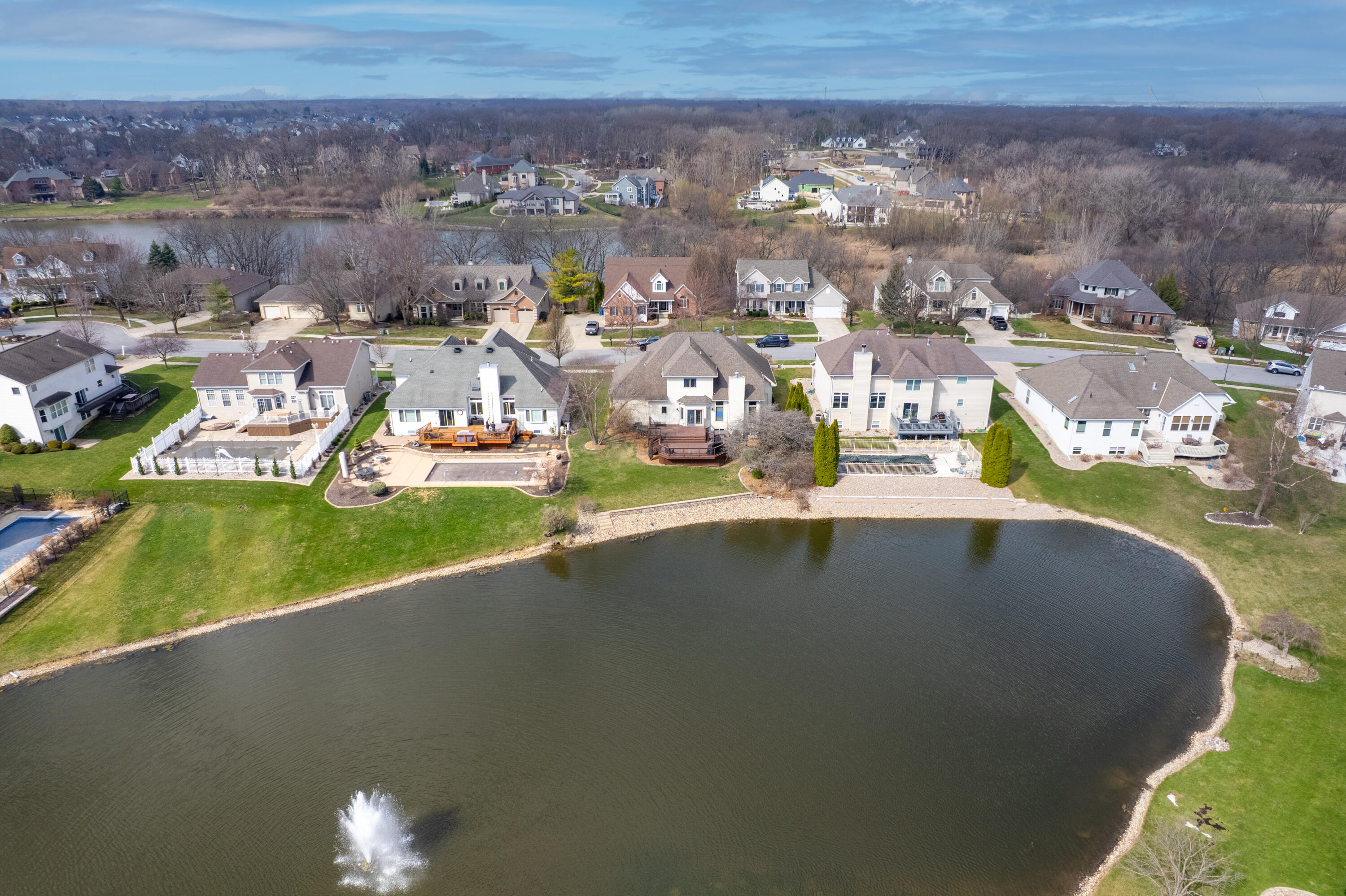 669 Davis Circle Crown Point, IN 46307 - Photo 22 of 22 an aerial view of a house with a garden and lake view