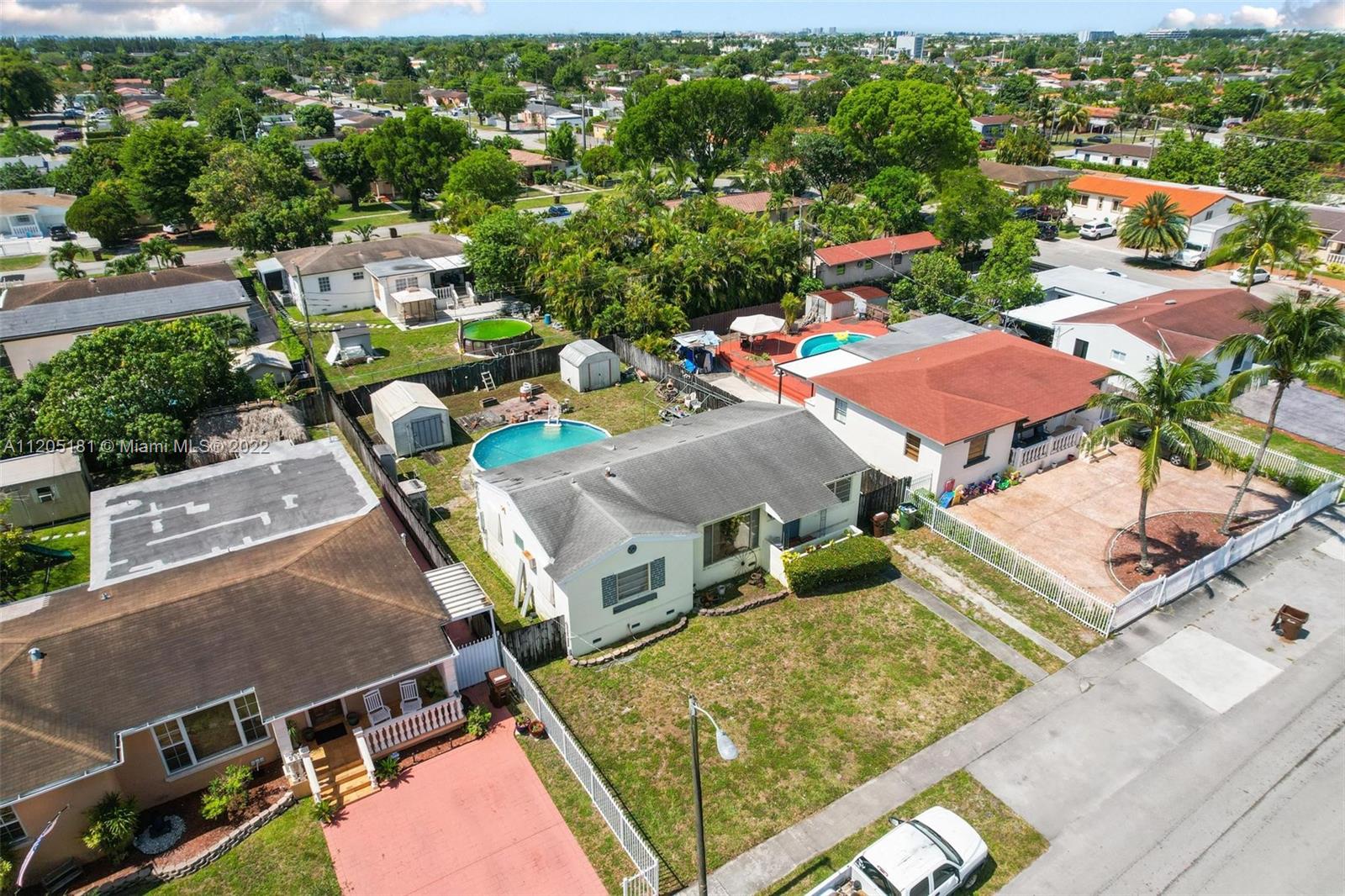 170 West 58th Street Hialeah, FL 33012 - Photo 6 of 12 an aerial view of residential houses with outdoor space
