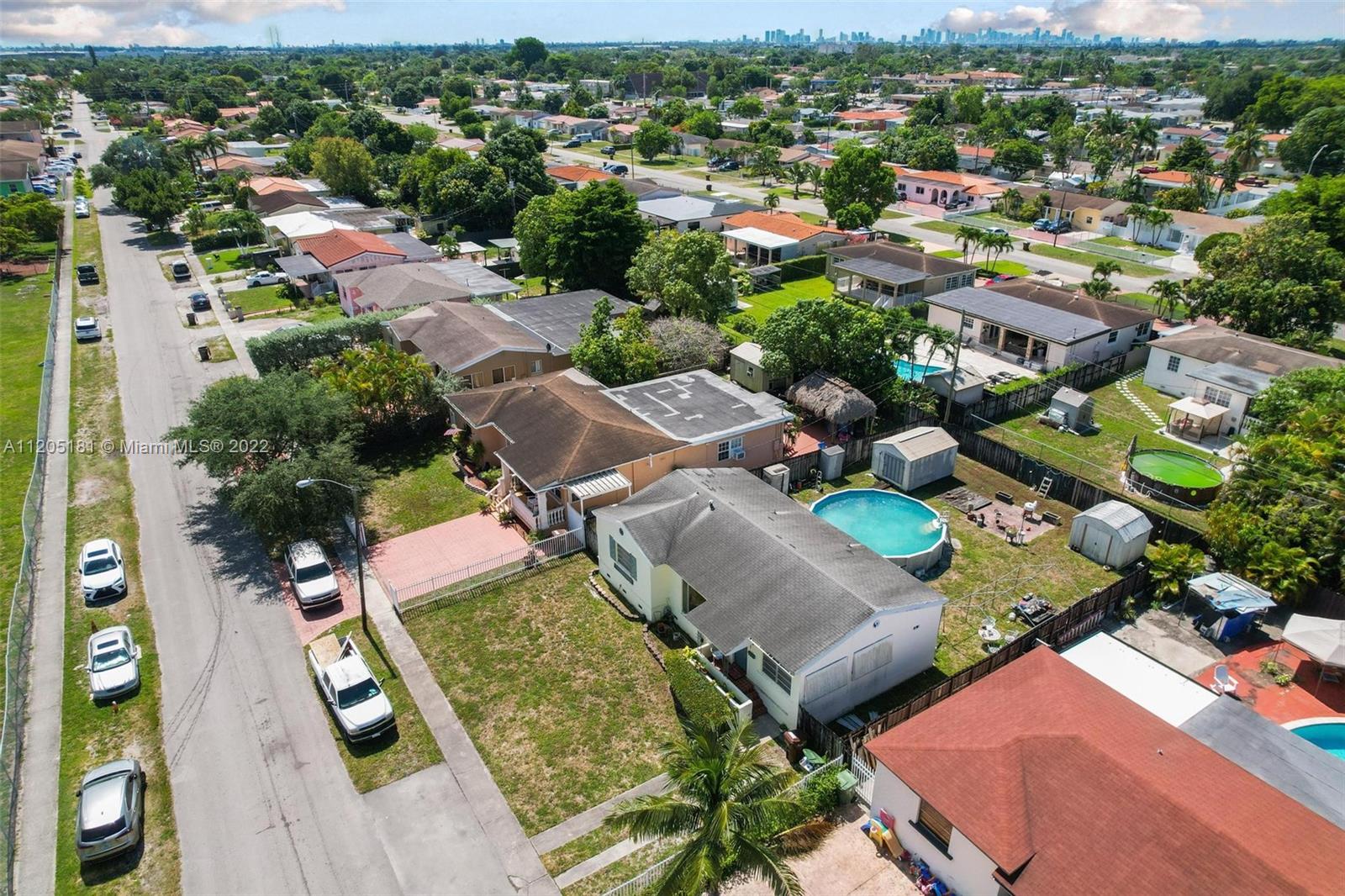 170 West 58th Street Hialeah, FL 33012 - Photo 7 of 12 an aerial view of a city with lots of residential buildings