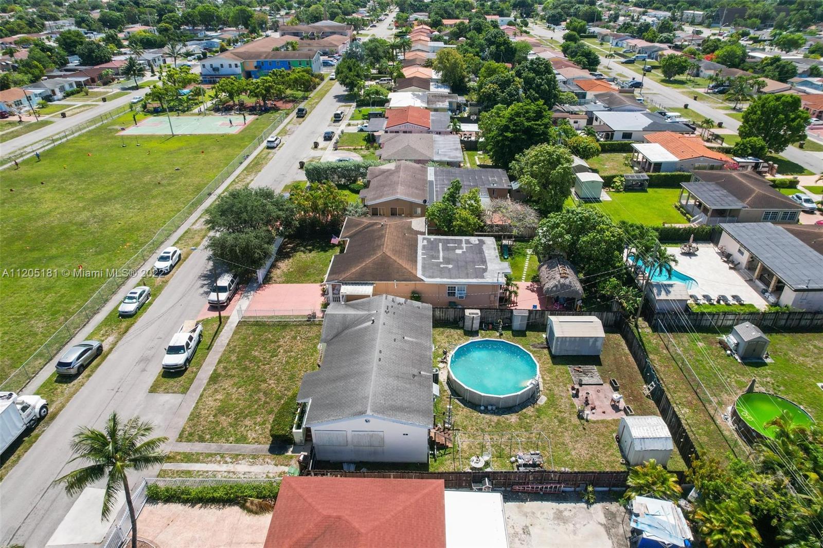 170 West 58th Street Hialeah, FL 33012 - Photo 8 of 12 an aerial view of a house with outdoor space pool seating area and yard
