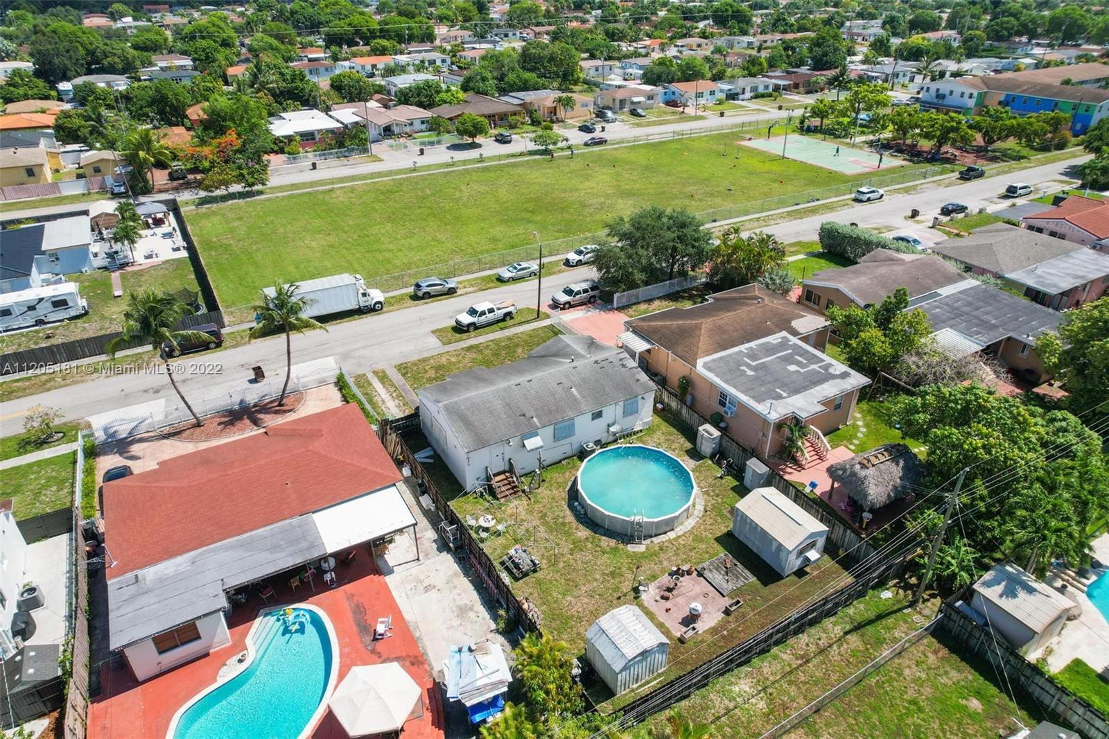170 West 58th Street Hialeah, FL 33012 - Photo 9 of 12 an aerial view of a pool patio swimming pool and outdoor space