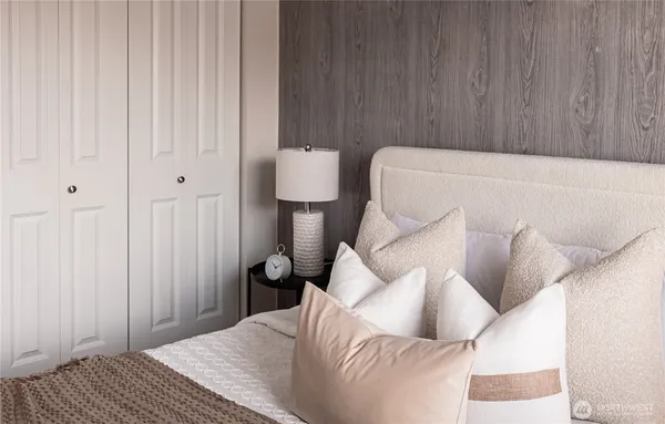 a bedroom with a bed and a couch