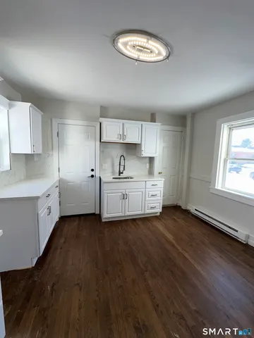 a kitchen with a sink cabinets and a dishwasher