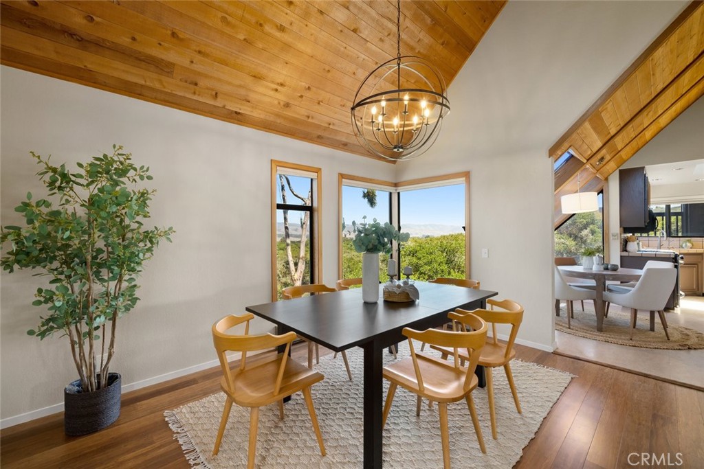 1606 Valley View Drive Los Osos, CA 93402 - Photo 11 of 50 a view of a dining room with furniture window and wooden floor