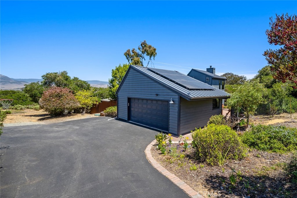 1606 Valley View Drive Los Osos, CA 93402 - Photo 3 of 50 a house with a yard and a lot of flower plants in front of main door