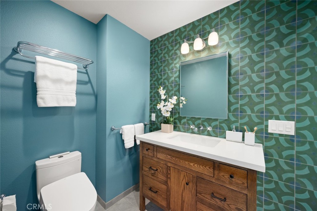 1606 Valley View Drive Los Osos, CA 93402 - Photo 35 of 50 a bathroom with a sink mirror and toilet