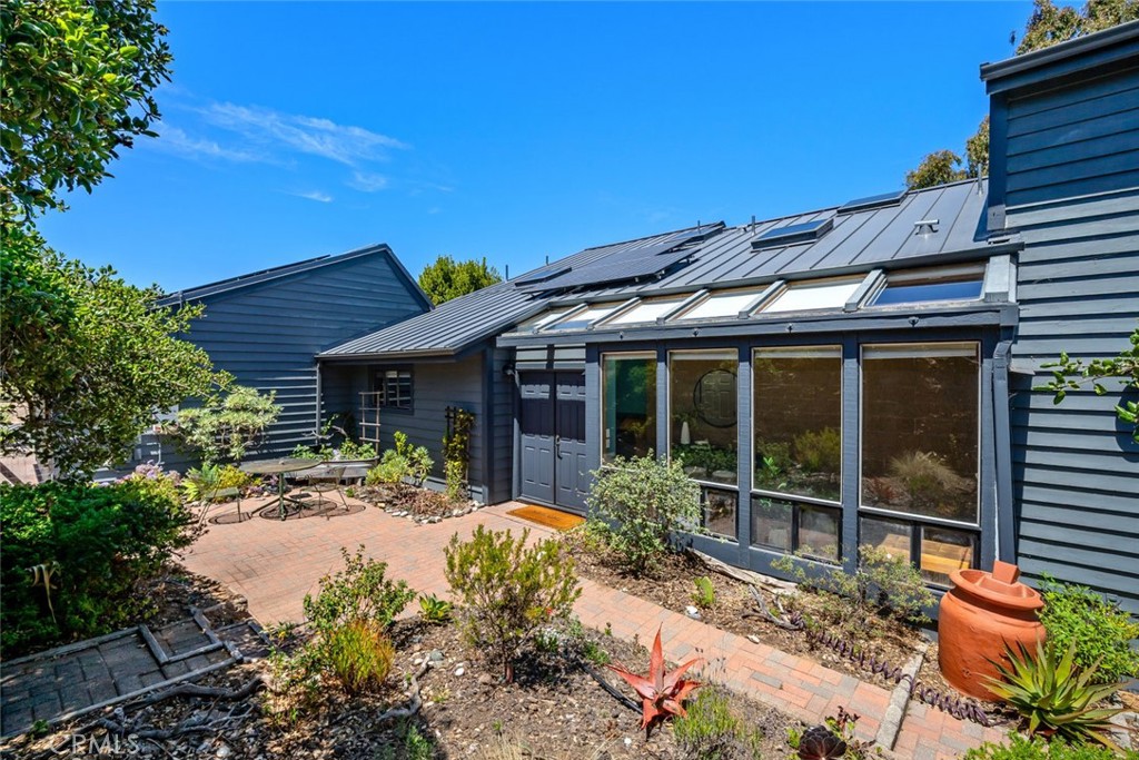 1606 Valley View Drive Los Osos, CA 93402 - Photo 5 of 50 a front view of a house with a garden