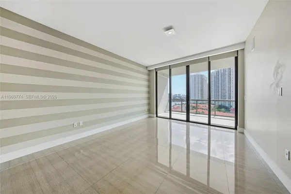 a view of an empty room and window