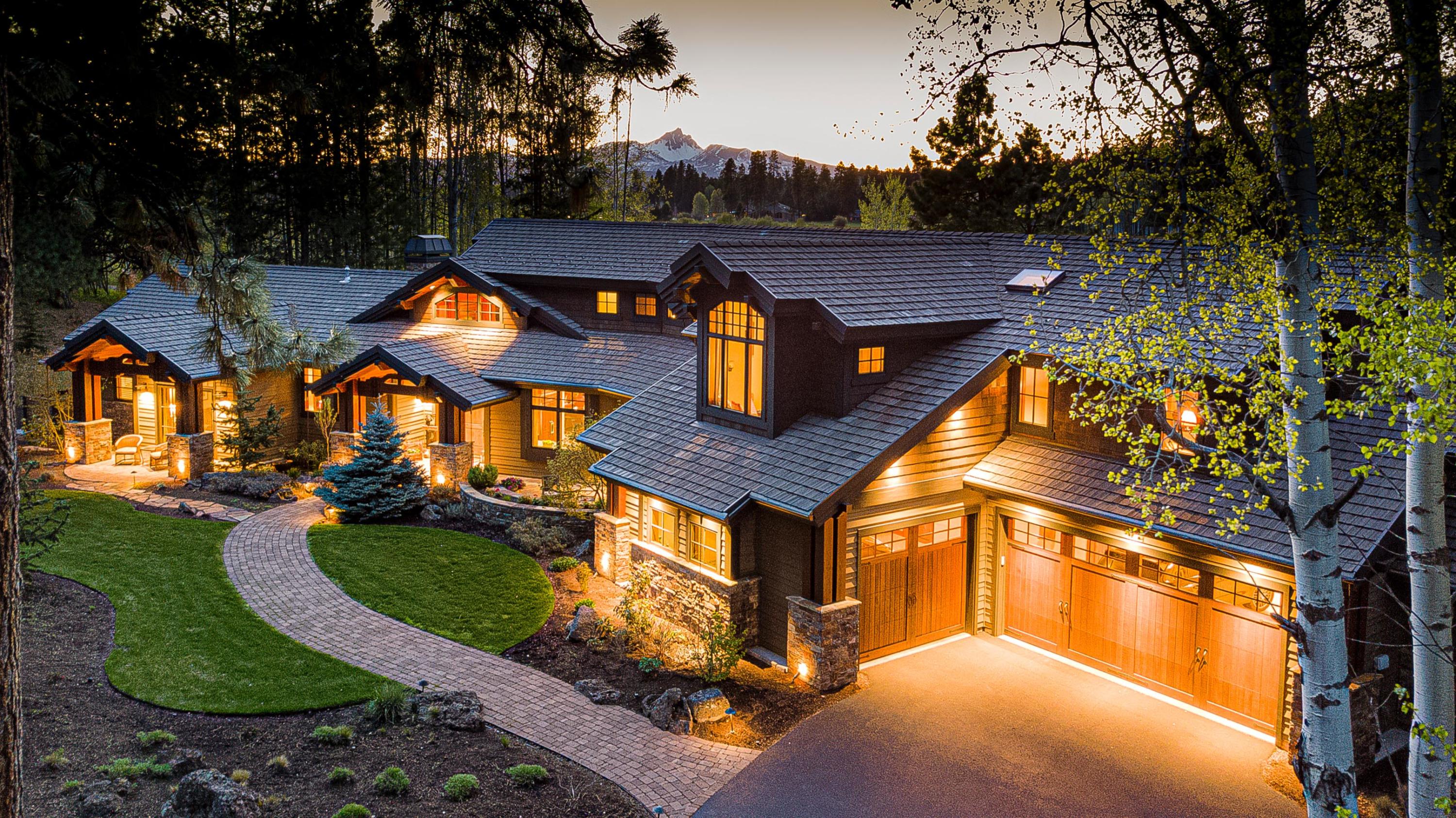 Completely private home from the road w/accent lighting throughout the yard.