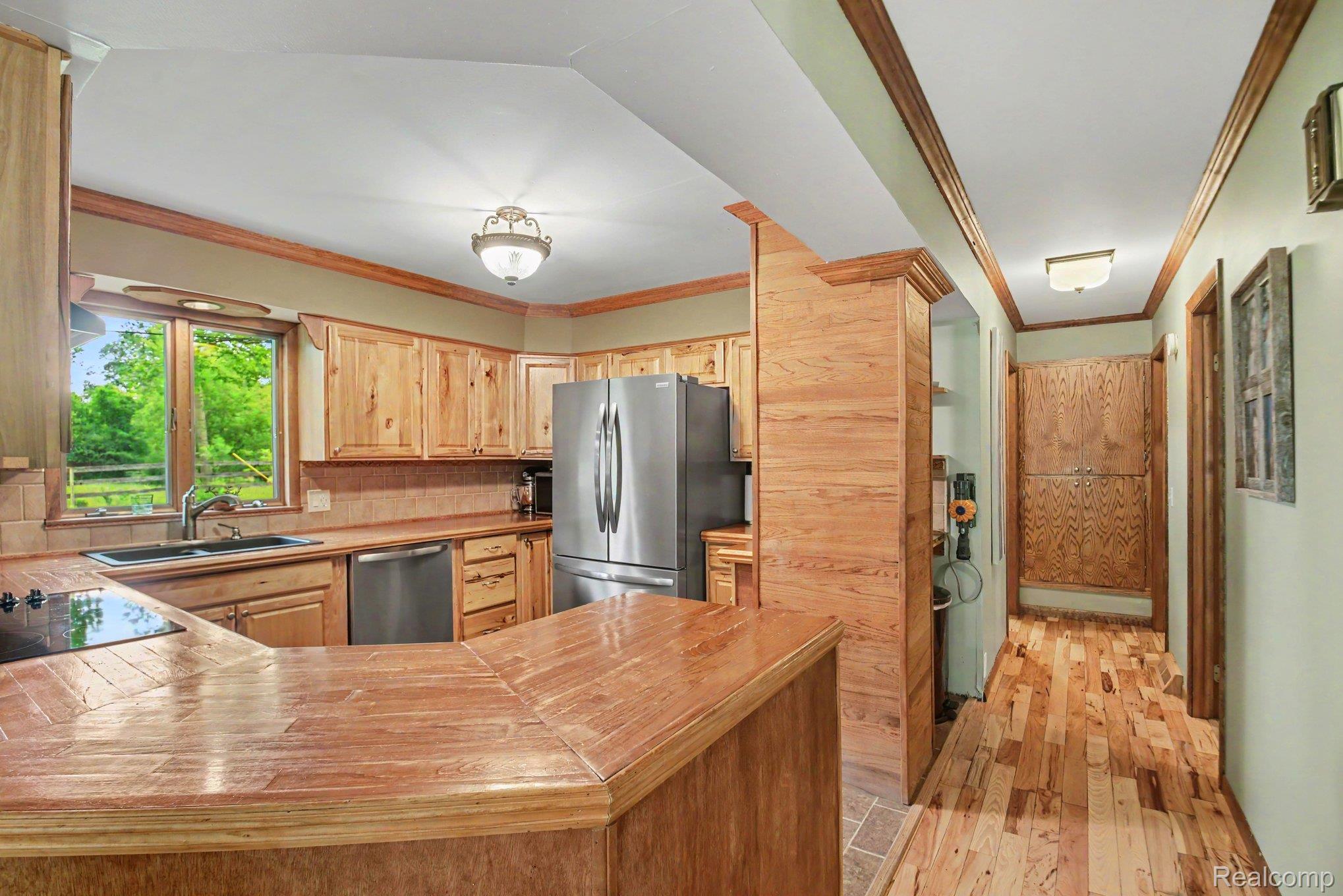 1646 Boy Scout Road Caro, MI 48723 - Photo 5 of 28 Kitchen featuring wood cabinetry, wood-finish countertops, and stainless steel appliances