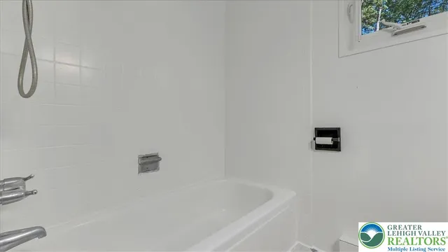 a bathroom with a shower and a bathtub