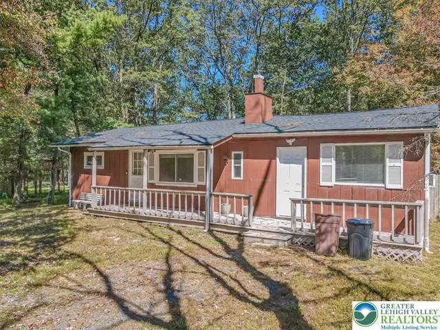 a front view of a house with a porch