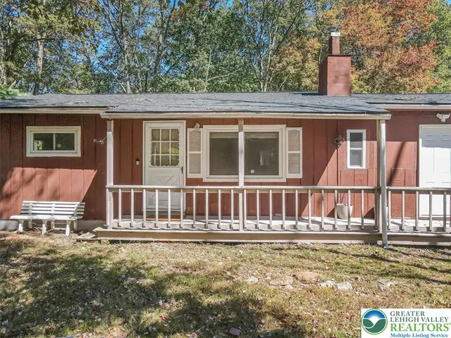 a front view of a house with large windows