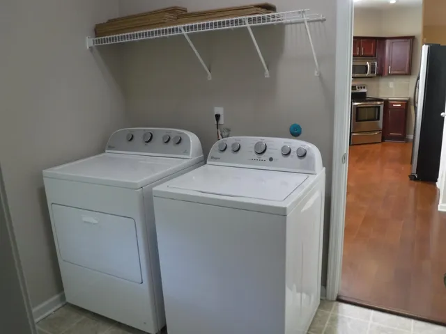a utility room with dryer and washer
