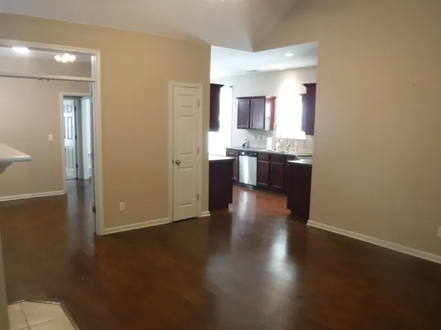 a view of a kitchen cabinets and wooden floor