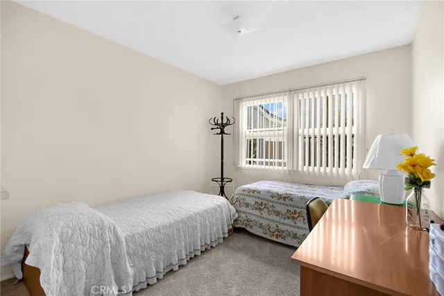 a bedroom with bed and a window