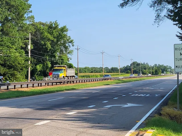 a house view with a sitting space and garden