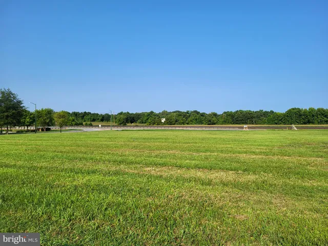 a view of a lake with a house in the background