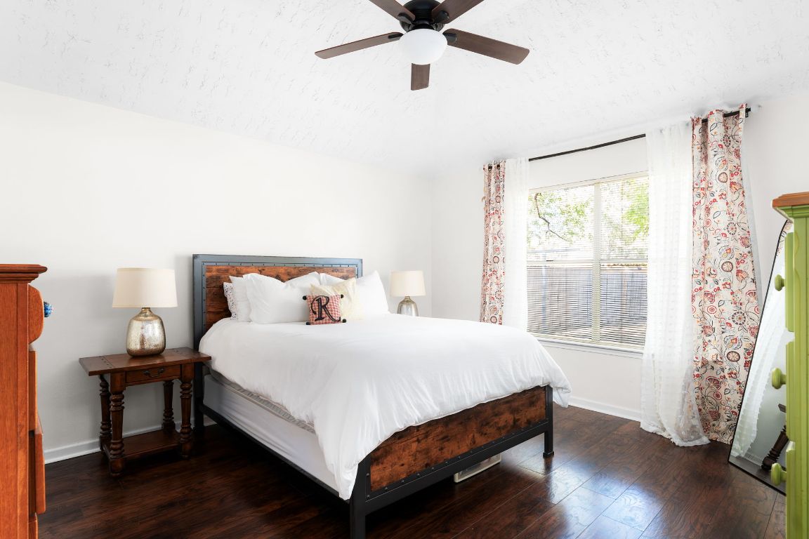 1412 Pigeon Forge Road Pflugerville, TX 78660 - Photo 10 of 20 a bedroom with a bed and wooden floor