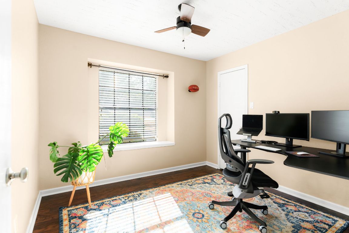 1412 Pigeon Forge Road Pflugerville, TX 78660 - Photo 14 of 20 a view of a workspace with furniture and a window