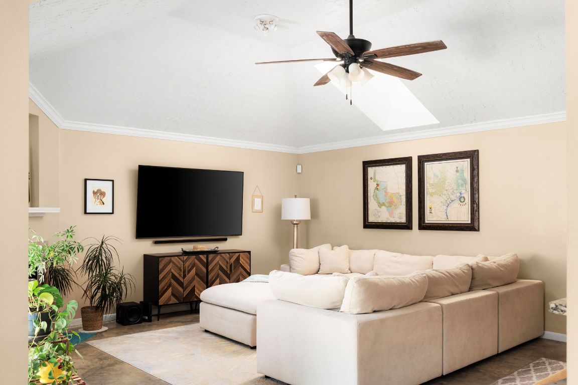 1412 Pigeon Forge Road Pflugerville, TX 78660 - Photo 3 of 20 a living room with furniture and a flat screen tv
