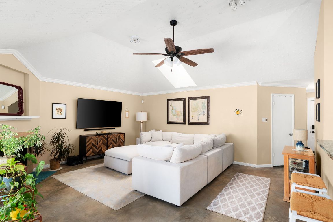 1412 Pigeon Forge Road Pflugerville, TX 78660 - Photo 4 of 20 a bedroom with bed and a flat screen tv